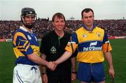 2 May 1999; Thomas Dunne of Tipperary and Anthony Daly of Clare shake hands in front of referee Dickie Murphy ahead of the Church & General National Hurling League Division 1 Semi-Final match between Clare and Tipperary at the Gaelic Grounds in Limerick. Photo by Ray McManus/Sportsfile