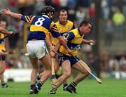2 May 1999; Colin Lynch of Clare in action against Eddie Enright of Tipperary during the Church & General National Hurling League Division 1 Semi-Final match between Clare and Tipperary at the Gaelic Grounds in Limerick. Photo by Ray McManus/Sportsfile