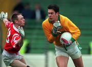 25 April 1999; Cormac Sullivan of Meath in action against Phillip Clifford of Cork during the Church & General National Football League Division 1 Semi-Final match between Cork and Meath at Croke Park in Dublin. Photo by Ray McManus/Sportsfile