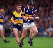 2 May 1999; David Kennedy of Tipperary in action against Jamesie O'Connor of Clare during the Church & General National Hurling League Division 1 Semi-Final match between Clare and Tipperary at the Gaelic Grounds in Limerick. Photo by Ray McManus/Sportsfile