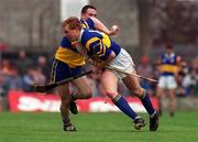 2 May 1999; Declan Ryan of Tipperary in action against Colin Lynch of Clare during the Church & General National Hurling League Division 1 Semi-Final match between Clare and Tipperary at the Gaelic Grounds in Limerick. Photo by Ray McManus/Sportsfile