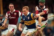 16 May 1999; Declan Ryan of Tipperary in action against Fergus Flynn, right, and Tom Kavanagh of Galway during the Church & General National Hurling League Division 1 Final match between Galway and Tipperary at Cusack Park in Ennis, Clare. Photo By Brendan Moran/Sportsfile