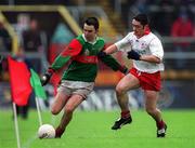 9 May 1999; Demetri Doherty of Mayo in action against Adrian McRory of Tyrone during the All-Ireland Vocational Schools' Intercounty Football Final match between Mayo and Tyrone at Páirc U’ Chaoimh in Cork. Photo by Ray McManus/Sportsfile