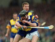 2 May 1999; Eddie Enright of Tipperary in action against James O'Connor of Clare during the Church & General National Hurling League Division 1 Semi-Final match between Clare and Tipperary at the Gaelic Grounds in Limerick. Photo by Ray McManus/Sportsfile