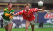 25 April 1999; Evan Kelly of Meath in action against Anthony Lynch of Cork during the Church & General National Football League Division 1 Semi-Final match between Cork and Meath at Croke Park in Dublin. Photo by Ray McManus/Sportsfile