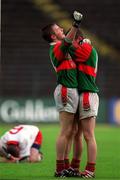 9 May 1999; Fegral Hobin, left, and Brian McMenamon of Mayo celebrate, as Fran Loughran of Tyrone reacts following the All-Ireland Vocational Schools' Intercounty Football Final match between Mayo and Tyrone at Páirc U’ Chaoimh in Cork. Photo by Ray McManus/Sportsfile