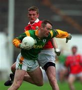 25 April 1999; Jimmy McGuinness of Meath in action against Nicholas Murphy of Cork during the Church & General National Football League Division 1 Semi-Final match between Cork and Meath at Croke Park in Dublin. Photo by Ray McManus/Sportsfile