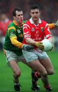 25 April 1999; Joe Kavanagh of Cork in action against Paddy Reynolds of Meath during the Church & General National Football League Division 1 Semi-Final match between Cork and Meath at Croke Park in Dublin. Photo by Ray McManus/Sportsfile