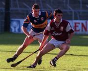 28 August 1997; Joe McGrath of Galway in action against George Frend of Tipperary during the Church & General National Hurling League Semi-Final match between Galway and Tipperary at Cusack Park in Ennis, Clare Photo by David Maher/Sportsfile