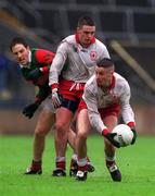 9 May 1999; Niall Quinn of Tyrone, supported by Fran Loughran, in action against Billy Joe Padden of Mayo during the All-Ireland Vocational Schools' Intercounty Football Final match between Mayo and Tyrone at Páirc U’ Chaoimh in Cork. Photo by Aoife Rice/Sportsfile
