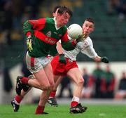9 May 1999; Padraig Keane of Mayo in action against Niall Quinn of Tyrone during the All-Ireland Vocational Schools' Intercounty Football Final match between Mayo and Tyrone at Páirc U’ Chaoimh in Cork. Photo by Ray McManus/Sportsfile