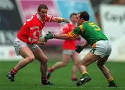 25 April 1999; Padraig O'Mahony of Cork in action against Paddy Reynolds of Meath during the Church & General National Football League Division 1 Semi-Final match between Cork and Meath at Croke Park in Dublin. Photo by Ray McManus/Sportsfile
