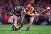 2 May 1999; Paul Shelly of Tipperary in action against Brian Lohan of Clare during the Church & General National Hurling League Division 1 Semi-Final match between Clare and Tipperary at the Gaelic Grounds in Limerick. Photo by Ray McManus/Sportsfile
