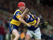 2 May 1999; Paul Shelly of Tipperary in action against Brian Lohan of Clare during the Church & General National Hurling League Division 1 Semi-Final match between Clare and Tipperary at the Gaelic Grounds in Limerick. Photo by Damien Eagers/Sportsfile