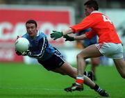 25 April 1999;  Ray Cosgrove of Dublin in action against Mark McNeill of Armagh during the Church & General National Football League Division 1 Semi-Final match between Armagh and Dublin at Croke Park in Dublin. Photo by Ray McManus/Sportsfile
