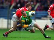 25 April 1999; Ray Magee of Meath in action against Anthony Lynch of Cork during the Church & General National Football League Division 1 Semi-Final match between Cork and Meath at Croke Park in Dublin. Photo by Ray McManus/Sportsfile
