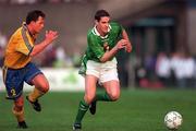 28 April 1999; Mark Kennedy of Republic of Ireland in action against Pontus Kaamark of Sweden during the International friendly match between Republic of Ireland and Sweden at Lansdowne Road in Dublin. Photo by David Maher/Sportsfile