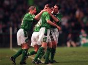 28 April 1999; Mark Kennedy of Republic of Ireland, centre, celebrates  with team-mates Graham Kavanagh, left, and Alan McLoughlin, right, after scoring his sides scond goal during the International friendly match between Republic of Ireland and Sweden at Lansdowne Road in Dublin. Photo by David Maher/Sportsfile