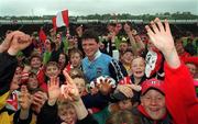 9 May 1999; Mark O'Sullivan of Cork is surrounded by supporters following the Church & General National Football League Final between Cork and Dublin at Páirc U’ Chaoimh in Cork. Photo by Ray McManus/Sportsfile