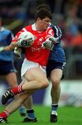 9 May 1999; Mark O'Sullivan of Cork in action against Paddy Christie of Dublin during the Church & General National Football League Final between Cork and Dublin at Páirc U’ Chaoimh in Cork. Photo by Ray McManus/Sportsfile