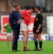25 April 1999; Martin Cronin of Cork receives medical attention during the Church & General National Football League Division 1 Semi-Final match between Cork and Meath at Croke Park in Dublin. Photo by Ray McManus/Sportsfile