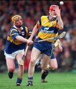 2 May 1999; Ronan O'Hara of Clare in action against Eamonn Corcoran of Tipperary during the Church & General National Hurling League Division 1 Semi-Final match between Clare and Tipperary at the Gaelic Grounds in Limerick. Photo by Ray McManus/Sportsfile