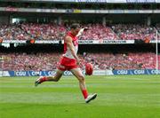 24 September 2005; Tadhg Kennelly, Sydney Swans, kicks a goal against the West Coast Eagles. AFL Grand Final, Sydney Swans v West Coast Eagles, Melbourne Cricket Ground, Melbourne, Australia. Picture credit; Kevin Nugent / SPORTSFILE