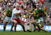 25 September 2005; Owen Mulligan, Tyrone, in action against Kerry players from left Mike McCarthy, Tom O'Sullivan and Seamus Moynihan, Bank of Ireland All-Ireland Senior Football Championship Final. Kerry v Tyrone, Croke Park, Dublin. Picture credit; Damien Eagers/ SPORTSFILE *** Local Caption *** Any photograph taken by SPORTSFILE during, or in connection with, the 2005 Bank of Ireland All-Ireland Senior Football Final which displays GAA logos or contains an image or part of an image of any GAA intellectual property, or, which contains images of a GAA player/players in their playing uniforms, may only be used for editorial and non-advertising purposes.  Use of photographs for advertising, as posters or for purchase separately is strictly prohibited unless prior written approval has been obtained from the Gaelic Athletic Association.