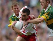 25 September 2005; Ryan McMenamin, Tyrone, in action against Dara O'Cinneide, left and Liam Hassett, Kerry, Bank of Ireland All-Ireland Senior Football Championship Final, Kerry v Tyrone, Croke Park, Dublin. Picture credit; Damien Eagers/ SPORTSFILE *** Local Caption *** Any photograph taken by SPORTSFILE during, or in connection with, the 2005 Bank of Ireland All-Ireland Senior Football Final which displays GAA logos or contains an image or part of an image of any GAA intellectual property, or, which contains images of a GAA player/players in their playing uniforms, may only be used for editorial and non-advertising purposes.  Use of photographs for advertising, as posters or for purchase separately is strictly prohibited unless prior written approval has been obtained from the Gaelic Athletic Association.