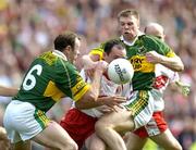 25 September 2005; Brian Dooher, Tyrone, in action against Seamus Moynihan (6) and Tomas O Se, Kerry. Bank of Ireland All-Ireland Senior Football Championship Final, Kerry v Tyrone, Croke Park, Dublin. Picture credit; Brendan Moran / SPORTSFILE *** Local Caption *** Any photograph taken by SPORTSFILE during, or in connection with, the 2005 Bank of Ireland All-Ireland Senior Football Final which displays GAA logos or contains an image or part of an image of any GAA intellectual property, or, which contains images of a GAA player/players in their playing uniforms, may only be used for editorial and non-advertising purposes.  Use of photographs for advertising, as posters or for purchase separately is strictly prohibited unless prior written approval has been obtained from the Gaelic Athletic Association.