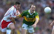 25 September 2005; Seamus Moynihan, Kerry, in action against Sean Cavanagh, Tyrone. Bank of Ireland All-Ireland Senior Football Championship Final, Kerry v Tyrone, Croke Park, Dublin. Picture credit; Brendan Moran / SPORTSFILE *** Local Caption *** Any photograph taken by SPORTSFILE during, or in connection with, the 2005 Bank of Ireland All-Ireland Senior Football Final which displays GAA logos or contains an image or part of an image of any GAA intellectual property, or, which contains images of a GAA player/players in their playing uniforms, may only be used for editorial and non-advertising purposes.  Use of photographs for advertising, as posters or for purchase separately is strictly prohibited unless prior written approval has been obtained from the Gaelic Athletic Association.