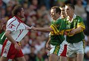 25 September 2005; Stephen O'Neill, Tyrone, in a tussle with Seamus Moynihan, Kerry. Bank of Ireland All-Ireland Senior Football Championship Final, Kerry v Tyrone, Croke Park, Dublin. Picture credit; Brendan Moran / SPORTSFILE *** Local Caption *** Any photograph taken by SPORTSFILE during, or in connection with, the 2005 Bank of Ireland All-Ireland Senior Football Final which displays GAA logos or contains an image or part of an image of any GAA intellectual property, or, which contains images of a GAA player/players in their playing uniforms, may only be used for editorial and non-advertising purposes.  Use of photographs for advertising, as posters or for purchase separately is strictly prohibited unless prior written approval has been obtained from the Gaelic Athletic Association.