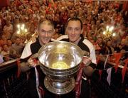 26 September 2005; Manager Mickey Harte, left, and captain Brian Dooher with the Sam Maguire cup prior to the victorious Tyrone team's departure to Tyrone for their homecoming. Citywest Hotel, Dublin. Picture credit; Damien Eagers/ SPORTSFILE