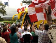 26 September 2005; Supporters cheer the Tyrone Coach as the victorious team depart for Tyrone for their homecoming. Citywest Hotel, Dublin. Picture credit; Damien Eagers/ SPORTSFILE