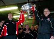26 September 2005; Tyrone captain Brian Dooher, left, and manager Mickey Harte lift the Sam Maguire cup at the victorious Tyrone team's homecoming. Aughnacloy, Co. Tyrone. Picture credit; Oliver McVeigh / SPORTSFILE