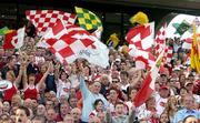 25 September 2005; Tyrone and Kerry fans cheer on their side before the game. Bank of Ireland All-Ireland Senior Football Championship Final, Kerry v Tyrone, Croke Park, Dublin. Picture credit; Brendan Moran / SPORTSFILE *** Local Caption *** Any photograph taken by SPORTSFILE during, or in connection with, the 2005 Bank of Ireland All-Ireland Senior Football Final which displays GAA logos or contains an image or part of an image of any GAA intellectual property, or, which contains images of a GAA player/players in their playing uniforms, may only be used for editorial and non-advertising purposes.  Use of photographs for advertising, as posters or for purchase separately is strictly prohibited unless prior written approval has been obtained from the Gaelic Athletic Association.