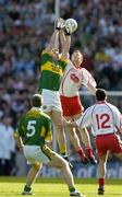 25 September 2005; William Kirby, Kerry, and Enda McGinley, Tyrone, contest a high ball. Bank of Ireland All-Ireland Senior Football Championship Final, Kerry v Tyrone, Croke Park, Dublin. Picture credit; Brendan Moran / SPORTSFILE *** Local Caption *** Any photograph taken by SPORTSFILE during, or in connection with, the 2005 Bank of Ireland All-Ireland Senior Football Final which displays GAA logos or contains an image or part of an image of any GAA intellectual property, or, which contains images of a GAA player/players in their playing uniforms, may only be used for editorial and non-advertising purposes.  Use of photographs for advertising, as posters or for purchase separately is strictly prohibited unless prior written approval has been obtained from the Gaelic Athletic Association.
