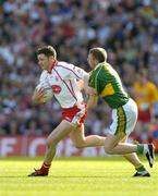 25 September 2005; Enda McGinley, Tyrone, in action against Tomas O Se, Kerry. Bank of Ireland All-Ireland Senior Football Championship Final, Kerry v Tyrone, Croke Park, Dublin. Picture credit; Brendan Moran / SPORTSFILE *** Local Caption *** Any photograph taken by SPORTSFILE during, or in connection with, the 2005 Bank of Ireland All-Ireland Senior Football Final which displays GAA logos or contains an image or part of an image of any GAA intellectual property, or, which contains images of a GAA player/players in their playing uniforms, may only be used for editorial and non-advertising purposes.  Use of photographs for advertising, as posters or for purchase separately is strictly prohibited unless prior written approval has been obtained from the Gaelic Athletic Association.