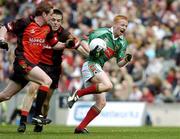 25 September 2005; Ronan O'Boyle, Mayo, in action against Kevin Duffin and Conor Garvey, Down. ESB All-Ireland Minor Football Championship Final, Mayo v Down, Croke Park, Dublin. Picture credit; Damien Eagers/ SPORTSFILE *** Local Caption *** Any photograph taken by SPORTSFILE during, or in connection with, the 2005 ESB All-Ireland Minor Football Final which displays GAA logos or contains an image or part of an image of any GAA intellectual property, or, which contains images of a GAA player/players in their playing uniforms, may only be used for editorial and non-advertising purposes.  Use of photographs for advertising, as posters or for purchase separately is strictly prohibited unless prior written approval has been obtained from the Gaelic Athletic Association.
