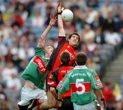25 September 2005; James Colgan, Down, rises for a high ball with Peter Collins, Mayo. ESB All-Ireland Minor Football Championship Final, Mayo v Down, Croke Park, Dublin. Picture credit; Damien Eagers/ SPORTSFILE *** Local Caption *** Any photograph taken by SPORTSFILE during, or in connection with, the 2005 ESB All-Ireland Minor Football Final which displays GAA logos or contains an image or part of an image of any GAA intellectual property, or, which contains images of a GAA player/players in their playing uniforms, may only be used for editorial and non-advertising purposes.  Use of photographs for advertising, as posters or for purchase separately is strictly prohibited unless prior written approval has been obtained from the Gaelic Athletic Association.