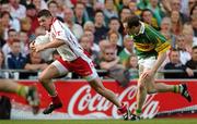 25 September 2005; Sean Cavanagh, Tyrone, in action against Seamus Moynihan, Kerry. Bank of Ireland All-Ireland Senior Football Championship Final, Kerry v Tyrone, Croke Park, Dublin. Picture credit; Brendan Moran / SPORTSFILE *** Local Caption *** Any photograph taken by SPORTSFILE during, or in connection with, the 2005 Bank of Ireland All-Ireland Senior Football Final which displays GAA logos or contains an image or part of an image of any GAA intellectual property, or, which contains images of a GAA player/players in their playing uniforms, may only be used for editorial and non-advertising purposes.  Use of photographs for advertising, as posters or for purchase separately is strictly prohibited unless prior written approval has been obtained from the Gaelic Athletic Association.