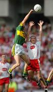 25 September 2005; Marc O Se, Kerry, in action against Brian Dooher, Tyrone. Bank of Ireland All-Ireland Senior Football Championship Final, Kerry v Tyrone, Croke Park, Dublin. Picture credit; Brendan Moran / SPORTSFILE *** Local Caption *** Any photograph taken by SPORTSFILE during, or in connection with, the 2005 Bank of Ireland All-Ireland Senior Football Final which displays GAA logos or contains an image or part of an image of any GAA intellectual property, or, which contains images of a GAA player/players in their playing uniforms, may only be used for editorial and non-advertising purposes.  Use of photographs for advertising, as posters or for purchase separately is strictly prohibited unless prior written approval has been obtained from the Gaelic Athletic Association.