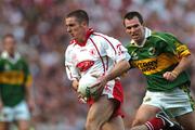 25 September 2005; Philip Jordan, Tyrone, in action against Michael McCarthy, Kerry. Bank of Ireland All-Ireland Senior Football Championship Final, Kerry v Tyrone, Croke Park, Dublin. Picture credit; Brendan Moran / SPORTSFILE *** Local Caption *** Any photograph taken by SPORTSFILE during, or in connection with, the 2005 Bank of Ireland All-Ireland Senior Football Final which displays GAA logos or contains an image or part of an image of any GAA intellectual property, or, which contains images of a GAA player/players in their playing uniforms, may only be used for editorial and non-advertising purposes.  Use of photographs for advertising, as posters or for purchase separately is strictly prohibited unless prior written approval has been obtained from the Gaelic Athletic Association.