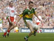 25 September 2005; Marc O Se, Kerry, in action against Ryan Mellon, Tyrone. Bank of Ireland All-Ireland Senior Football Championship Final, Kerry v Tyrone, Croke Park, Dublin. Picture credit; Damien Eagers/ SPORTSFILE *** Local Caption *** Any photograph taken by SPORTSFILE during, or in connection with, the 2005 Bank of Ireland All-Ireland Senior Football Final which displays GAA logos or contains an image or part of an image of any GAA intellectual property, or, which contains images of a GAA player/players in their playing uniforms, may only be used for editorial and non-advertising purposes.  Use of photographs for advertising, as posters or for purchase separately is strictly prohibited unless prior written approval has been obtained from the Gaelic Athletic Association.
