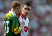 25 September 2005; Ryan McMenamin, Tyrone, speaks to Kerry's Colm Cooper during the match. Bank of Ireland All-Ireland Senior Football Championship Final, Kerry v Tyrone, Croke Park, Dublin. Picture credit; Damien Eagers/ SPORTSFILE *** Local Caption *** Any photograph taken by SPORTSFILE during, or in connection with, the 2005 Bank of Ireland All-Ireland Senior Football Final which displays GAA logos or contains an image or part of an image of any GAA intellectual property, or, which contains images of a GAA player/players in their playing uniforms, may only be used for editorial and non-advertising purposes.  Use of photographs for advertising, as posters or for purchase separately is strictly prohibited unless prior written approval has been obtained from the Gaelic Athletic Association.