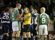 29 September 2005; Referee Phillippe Leuba, shows his watch to Derek Coughlan, left and John O'Flynn, Cork City, at the end of the game. UEFA Cup, First Round, Second Leg, Cork City v Slavia Prague, Turners Cross, Cork. Picture credit: David Maher / SPORTSFILE