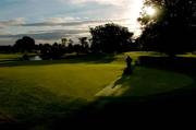 20 September 2005; A greenkeeper cuts the grass on the 18th green. Druids Glen Golf Resort, Co. Wicklow. Picture credit; David Maher / SPORTSFILE