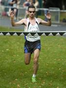 24 September 2005; Neil Cusack crosses the line to win the Mens adidas Dublin half-marathon. Phoenix Park, Dublin. Picture credit; Damien Eagers / SPORTSFILE