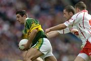 25 September 2005; Aidan O'Mahony, Kerry, in action against Stephen O'Neill and Sean Cavanagh, Tyrone. Bank of Ireland All-Ireland Senior Football Championship Final, Kerry v Tyrone, Croke Park, Dublin. Picture credit; Brendan Moran / SPORTSFILE *** Local Caption *** Any photograph taken by SPORTSFILE during, or in connection with, the 2005 Bank of Ireland All-Ireland Senior Football Final which displays GAA logos or contains an image or part of an image of any GAA intellectual property, or, which contains images of a GAA player/players in their playing uniforms, may only be used for editorial and non-advertising purposes.  Use of photographs for advertising, as posters or for purchase separately is strictly prohibited unless prior written approval has been obtained from the Gaelic Athletic Association.