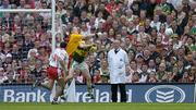 25 September 2005; Tyrone goalkeeper Pascal McConnell punches the ball away from Colm Cooper, Kerry. Bank of Ireland All-Ireland Senior Football Championship Final, Kerry v Tyrone, Croke Park, Dublin. Picture credit; Brendan Moran / SPORTSFILE *** Local Caption *** Any photograph taken by SPORTSFILE during, or in connection with, the 2005 Bank of Ireland All-Ireland Senior Football Final which displays GAA logos or contains an image or part of an image of any GAA intellectual property, or, which contains images of a GAA player/players in their playing uniforms, may only be used for editorial and non-advertising purposes.  Use of photographs for advertising, as posters or for purchase separately is strictly prohibited unless prior written approval has been obtained from the Gaelic Athletic Association.